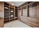 This walk-in closet features built in shelving, cabinets, and hanging storage at 8125 Via Rosa, Orlando, FL 32836