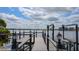Picturesque lakeside dock with lights and stunning waterfront views at 8125 Via Rosa, Orlando, FL 32836