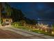 Lakeside dock, lights, and cooking area with waterfront view and night lights at 8125 Via Rosa, Orlando, FL 32836
