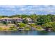 Picturesque waterfront homes feature private docks, screened patios, and access to the serene lake at 8125 Via Rosa, Orlando, FL 32836