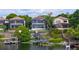 Waterfront property featuring multiple levels, screened patios, and private dock access to the tranquil lake at 8125 Via Rosa, Orlando, FL 32836