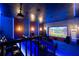 Enjoy movies in this home theater complete with projector and reclining seats at 8125 Via Rosa, Orlando, FL 32836