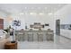Modern kitchen features sleek white cabinetry, a large island, and contemporary pendant lighting at 8125 Via Rosa, Orlando, FL 32836