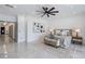 Spacious main bedroom with large windows, neutral tones, and modern ceiling fan at 8125 Via Rosa, Orlando, FL 32836
