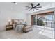 Serene main bedroom featuring a private balcony with lake views and modern decor at 8125 Via Rosa, Orlando, FL 32836