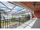 The outdoor patio features a screened-in enclosure and lake views at 8125 Via Rosa, Orlando, FL 32836