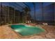 Enjoy swimming year round in this large enclosed in-ground pool with water views at night at 8125 Via Rosa, Orlando, FL 32836