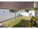 Fenced backyard featuring grass, a hammock, playhouse and a shade covering at 900 S Maple Ave, Sanford, FL 32771