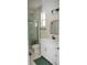 Bathroom featuring a glass shower, tiled walls, and modern vanity at 900 S Maple Ave, Sanford, FL 32771