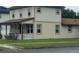 Side view of a two-story house displaying clean lines and a well-maintained yard at 900 S Maple Ave, Sanford, FL 32771