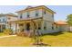 Charming two-story home with a welcoming front porch and well-maintained lawn at 900 S Maple Ave, Sanford, FL 32771