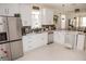 Modern kitchen with white cabinets, stainless steel appliances, and stylish countertops at 900 S Maple Ave, Sanford, FL 32771