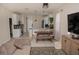 Open-concept living and dining area with modern decor and lots of natural light at 900 S Maple Ave, Sanford, FL 32771