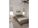 Serene main bedroom with neutral tones, comfortable bed, and ample natural light at 900 S Maple Ave, Sanford, FL 32771