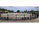 Community splash pad with colorful design, benches, and fountains, enclosed by a black iron fence at 900 S Maple Ave, Sanford, FL 32771