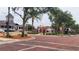 View of a street with brick pavers surrounded by mature trees and businesses at 900 S Maple Ave, Sanford, FL 32771