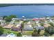 Wonderful aerial view of waterfront property with a large body of water in the background and mature landscaping at 1148 Martin L King Dr, Orlando, FL 32805