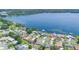Aerial view showcasing lakeside homes with picturesque views of the serene lake at 1148 Martin L King Dr, Orlando, FL 32805