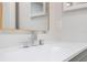 Modern bathroom sink featuring a chrome faucet and a large mirror at 1148 Martin L King Dr, Orlando, FL 32805