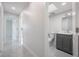 Stylish bathroom boasts modern fixtures, sleek gray vanity, and elegant arched mirror at 1148 Martin L King Dr, Orlando, FL 32805