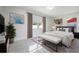 Bright bedroom featuring neutral decor, modern furnishings, and ample natural light at 1148 Martin L King Dr, Orlando, FL 32805