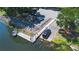 A public boat ramp by the lake featuring a boat, a dock, and parking spaces at 1148 Martin L King Dr, Orlando, FL 32805