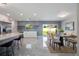 Open-concept dining room with a modern table, chairs, and easy access to the backyard at 1148 Martin L King Dr, Orlando, FL 32805