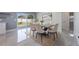 Beautiful dining room with sliding glass doors, neutral decor, and access to the outdoor patio at 1148 Martin L King Dr, Orlando, FL 32805