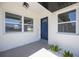 Stylish front door entrance with modern tiles, fresh landscaping, and natural light at 1148 Martin L King Dr, Orlando, FL 32805