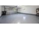 Spacious garage with gray epoxy floors and ample storage space, water heater shown at 1148 Martin L King Dr, Orlando, FL 32805