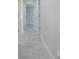 Bright hallway with elegant tile floors, recessed lighting, and neutral paint at 1148 Martin L King Dr, Orlando, FL 32805
