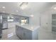 Well-lit kitchen with a center island, modern cabinetry, and stainless steel appliances at 1148 Martin L King Dr, Orlando, FL 32805
