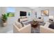 Inviting living room with natural light, modern furnishings, and stylish decor at 1148 Martin L King Dr, Orlando, FL 32805
