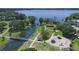 Aerial view of a park with a playground, walking paths, and scenic lake views at 1148 Martin L King Dr, Orlando, FL 32805