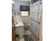 Bathroom featuring a vanity with a marble countertop, a neutral color scheme, and a shower with patterned curtain at 116 E Palm Way, Edgewater, FL 32132