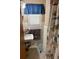 Bathroom featuring vanity with a sink, window, and shower with fun cartoon curtain at 116 E Palm Way, Edgewater, FL 32132
