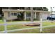 Charming single-story home with a well-maintained front yard, fenced in with an attached garage at 116 E Palm Way, Edgewater, FL 32132