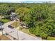 Beautiful aerial view of a house in a lush, tree-filled neighborhood, showcasing the surrounding environment at 12 N Forest Ave, Orlando, FL 32803