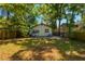 Lush backyard with a well-manicured lawn, offering ample space for outdoor activities and relaxation at 12 N Forest Ave, Orlando, FL 32803