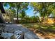 Expansive backyard featuring a paved patio and lush green lawn, ideal for outdoor activities at 12 N Forest Ave, Orlando, FL 32803