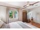 Comfortable bedroom with wooden floors, modern wardrobe, bright windows and neutral decor at 12 N Forest Ave, Orlando, FL 32803