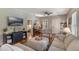 Spacious living room with hardwood floors, comfortable seating, and a modern TV console at 12 N Forest Ave, Orlando, FL 32803
