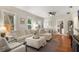 Comfortable living room with ample natural light, hardwood floors, and neutral decor at 12 N Forest Ave, Orlando, FL 32803