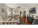 Inviting living room with hardwood floors, ceiling fan, and an open layout at 12 N Forest Ave, Orlando, FL 32803