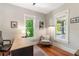 Cozy office space featuring natural light, hardwood floors, and a comfortable sitting area at 12 N Forest Ave, Orlando, FL 32803