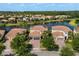 This aerial view shows the beautiful homes and peaceful lake in this Gathering friendly community at 12173 Aztec Rose Ln, Orlando, FL 32827
