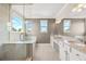 Bright bathroom features a tub, shower, and double sink vanity with granite countertops at 12173 Aztec Rose Ln, Orlando, FL 32827