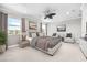 Beautiful bedroom features neutral decor, a ceiling fan, and large windows at 12173 Aztec Rose Ln, Orlando, FL 32827
