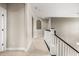 Upstairs hallway with neutral carpet, white trim, and a view of the staircase at 12173 Aztec Rose Ln, Orlando, FL 32827
