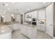 Spacious kitchen featuring an island, stainless steel appliances, and white cabinetry at 12173 Aztec Rose Ln, Orlando, FL 32827